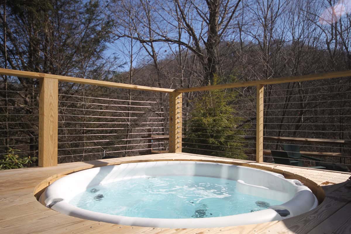 The Grove private in-deck hot tub surrounded by trees